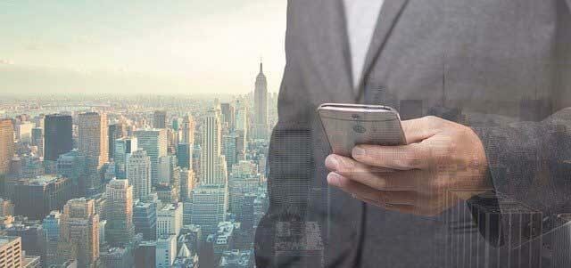 A businessman browsing websites from his smartphone