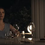 Drops of God Season 2 Elegant woman enjoying wine tasting at night with candles and glasses.