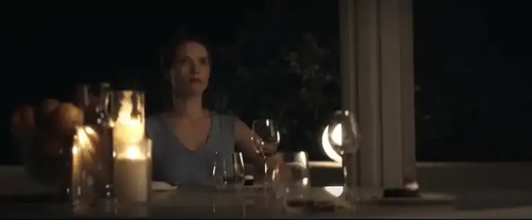 Drops of God Season 2: Real luxury is not what you think it might be Elegant woman enjoying wine tasting at night with candles and glasses.