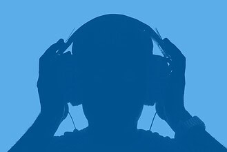 Headphones user enjoying music, silhouette of a person listening to audio.