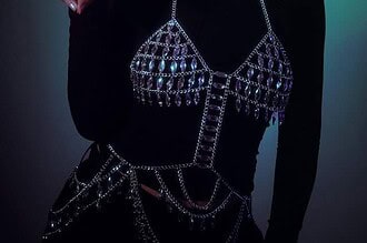 JULITH wearing a furry hat and stylish jewelry, promoting her debut EP.